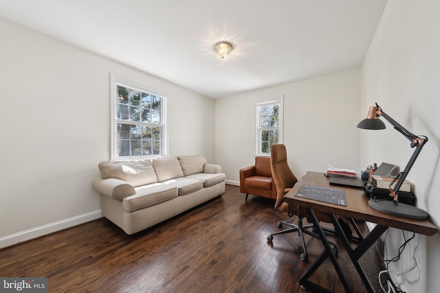 office area featuring baseboards and dark wood-type flooring