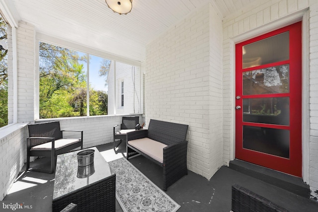 sunroom with an outdoor living space