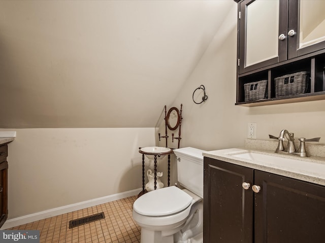 373 Thunder Hill Dr, Summit Point, WV 25446 - bathroom featuring toilet, vanity, vaulted ceiling, tile patterned floors, and baseboards
