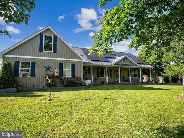 373 Thunder Hill Dr, Summit Point, WV 25446 - view of front of house with a porch, roof mounted solar panels, board and batten siding, and a front yard