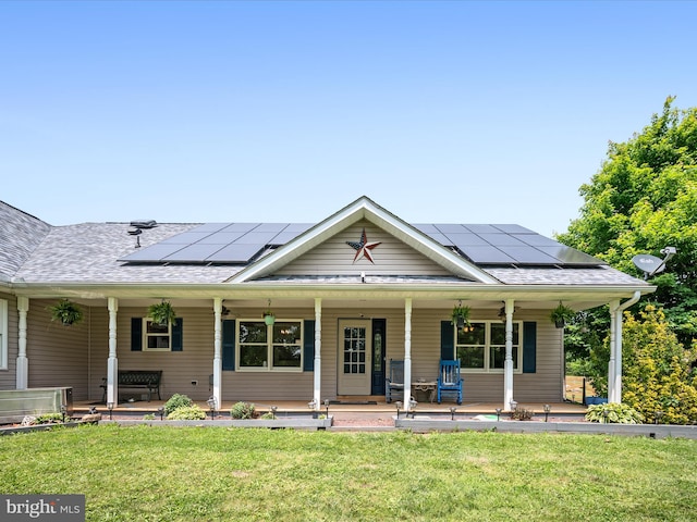 373 Thunder Hill Dr, Summit Point, WV 25446 - view of front of property with a front lawn, roof mounted solar panels, a shingled roof, and covered porch