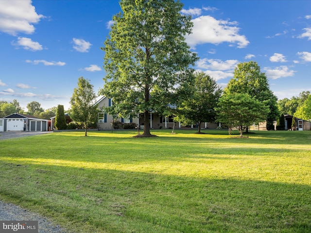 373 Thunder Hill Dr, Summit Point, WV 25446 - view of green lawn with a detached garage and an outbuilding