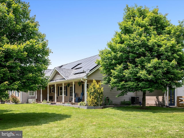 373 Thunder Hill Dr, Summit Point, WV 25446 - view of front of home featuring covered porch, roof mounted solar panels, and a front lawn