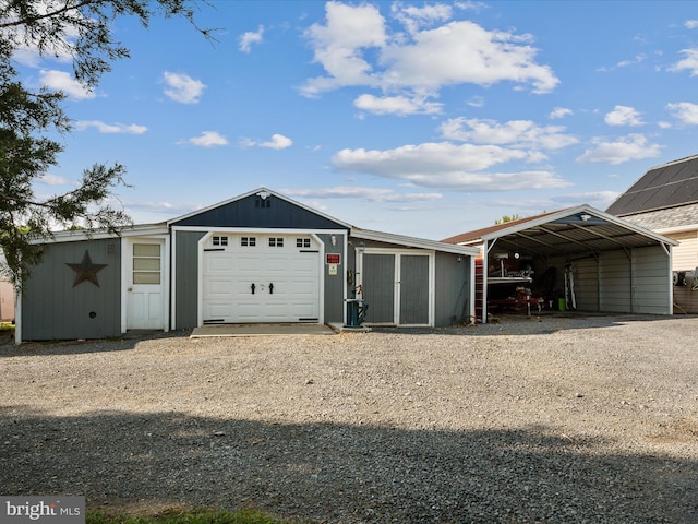 373 Thunder Hill Dr, Summit Point, WV 25446 - garage featuring a detached carport and driveway