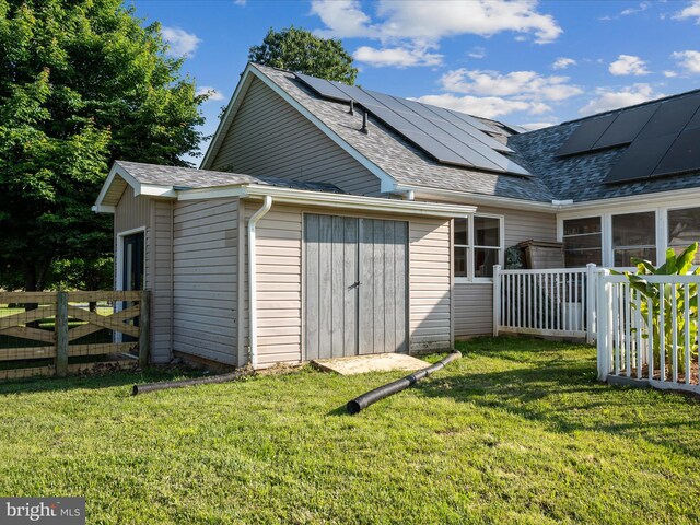 373 Thunder Hill Dr, Summit Point, WV 25446 - back of property with roof with shingles and roof mounted solar panels