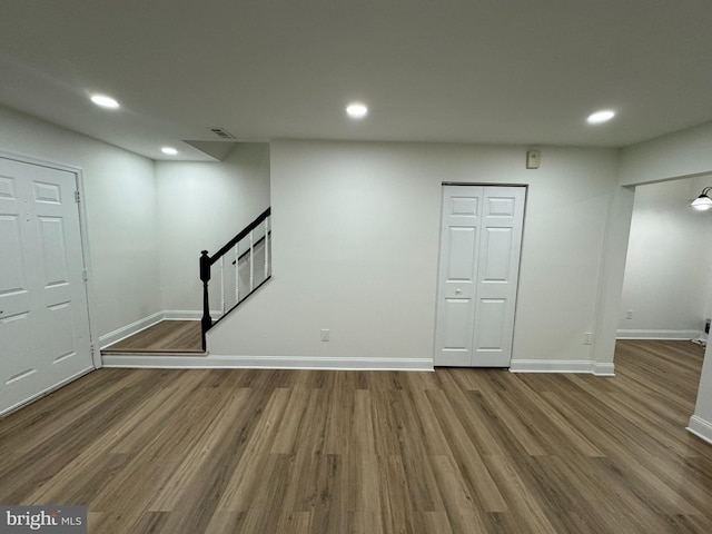 below grade area featuring baseboards, recessed lighting, and wood finished floors