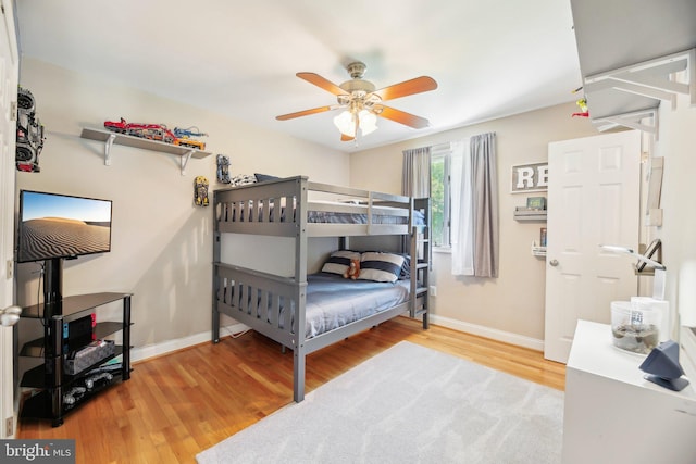 7925 Belhaven Ave, Pasadena, MD 21122 - bedroom with wood finished floors, baseboards, and a ceiling fan