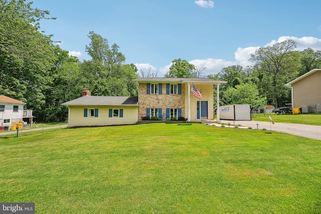 7925 Belhaven Ave, Pasadena, MD 21122 - view of front of home with a chimney