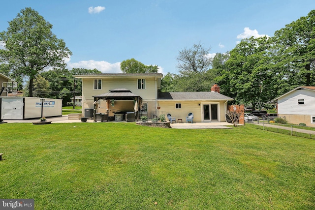7925 Belhaven Ave, Pasadena, MD 21122 - rear view of property with a patio, a gazebo, and a chimney