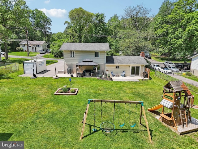 7925 Belhaven Ave, Pasadena, MD 21122 - back of property featuring a gazebo, a playground, a patio area, and a chimney