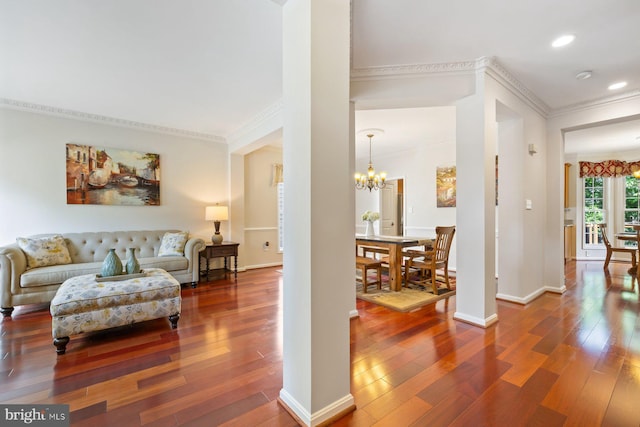 living area with crown molding, a chandelier, hardwood / wood-style floors, recessed lighting, and baseboards