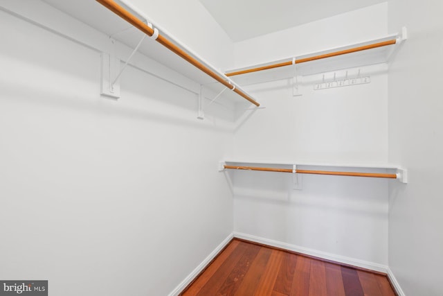 spacious closet with wood finished floors