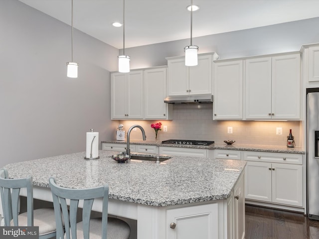 1513 Yellow Sand Ln, Odenton, MD 21113 - kitchen featuring a sink, appliances with stainless steel finishes, under cabinet range hood, decorative backsplash, and white cabinets