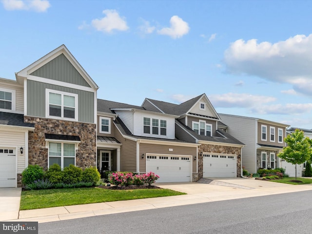 1513 Yellow Sand Ln, Odenton, MD 21113 - multi unit property featuring stone siding, board and batten siding, driveway, and a garage