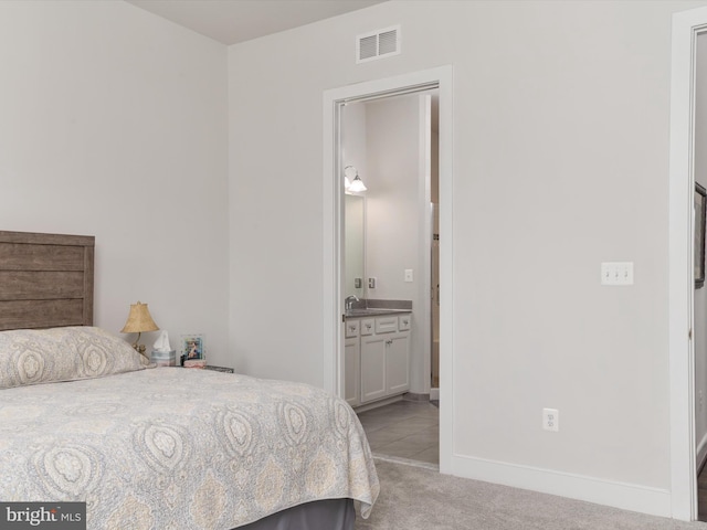 1513 Yellow Sand Ln, Odenton, MD 21113 - bedroom with light carpet, a sink, baseboards, and connected bathroom