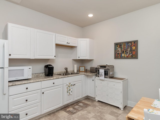 1513 Yellow Sand Ln, Odenton, MD 21113 - kitchen featuring white appliances, a sink, white cabinetry, recessed lighting, and baseboards