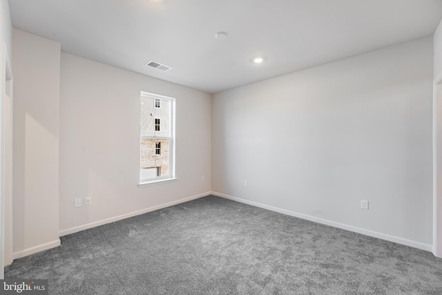spare room featuring visible vents, recessed lighting, carpet, and baseboards