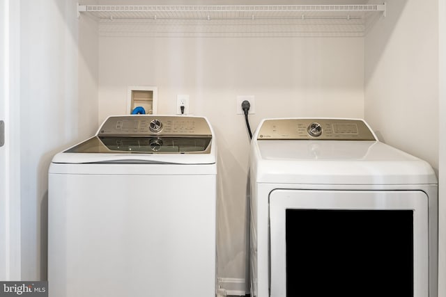 laundry area featuring washer and dryer and laundry area