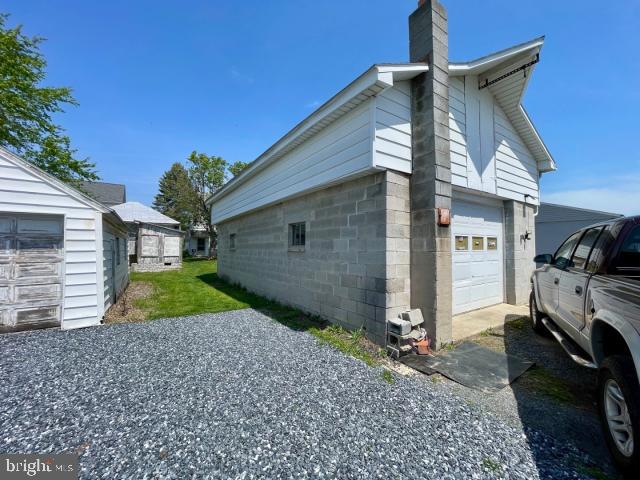 view of home's exterior featuring a chimney