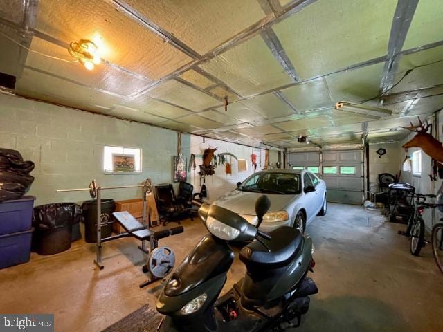 garage with concrete block wall