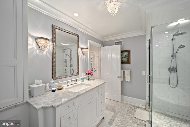 full bathroom with a shower stall, a chandelier, crown molding, vanity, and tile patterned floors