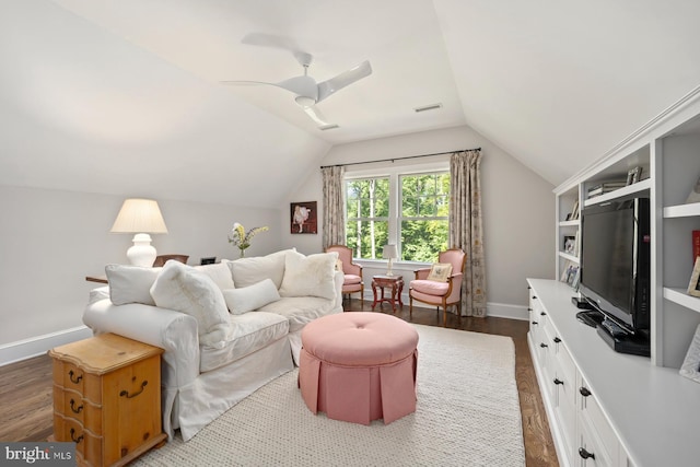 living room with dark wood-style flooring, baseboards, vaulted ceiling, and ceiling fan