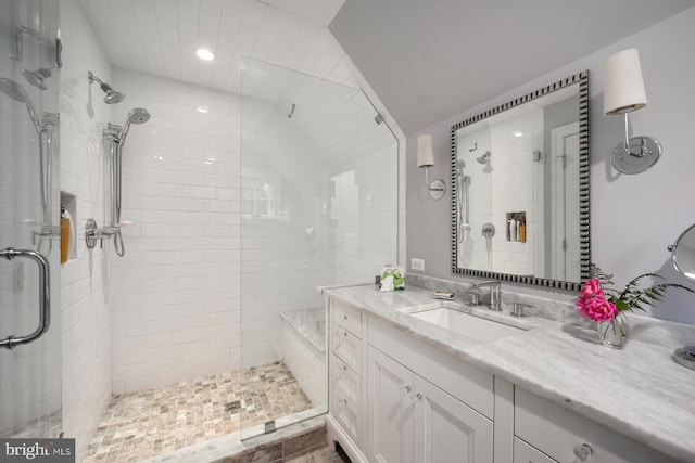 bathroom with a shower stall, vanity, and recessed lighting