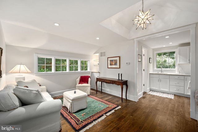 living room with lofted ceiling, dark wood-type flooring, baseboards, and recessed lighting