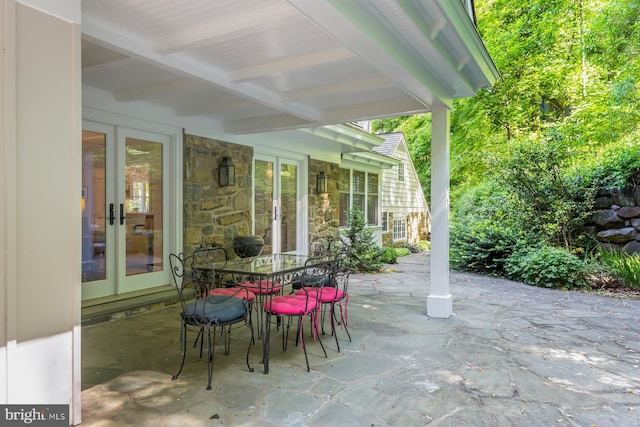 view of patio featuring french doors and outdoor dining area