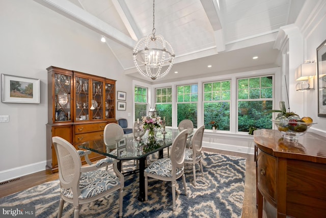 dining space featuring a chandelier, wood finished floors, baseboards, and recessed lighting