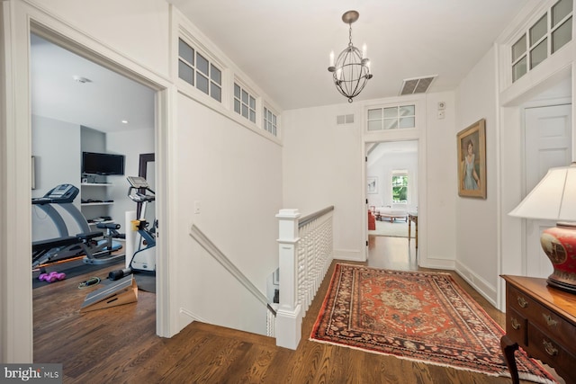 1660 Mount Pleasant Rd, Villanova, PA 19085 - hallway with an inviting chandelier, wood finished floors, an upstairs landing, and visible vents