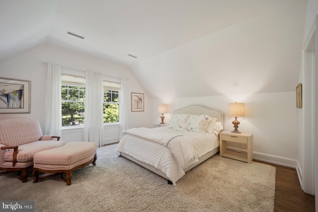 1660 Mount Pleasant Rd, Villanova, PA 19085 - bedroom with baseboards, visible vents, wood finished floors, and lofted ceiling