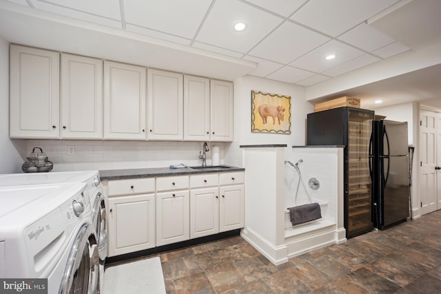 1660 Mount Pleasant Rd, Villanova, PA 19085 - washroom featuring independent washer and dryer, recessed lighting, stone finish floor, a sink, and laundry area