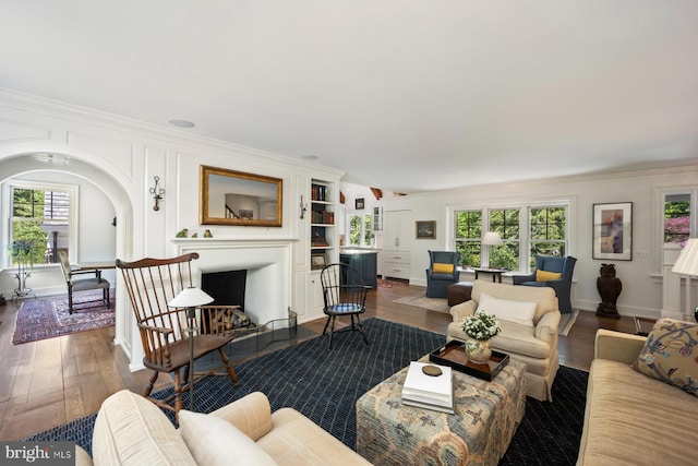 1660 Mount Pleasant Rd, Villanova, PA 19085 - living room featuring baseboards, crown molding, a fireplace with flush hearth, and dark wood-style floors