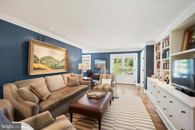 1660 Mount Pleasant Rd, Villanova, PA 19085 - living area with ornamental molding, french doors, visible vents, and light wood-style flooring