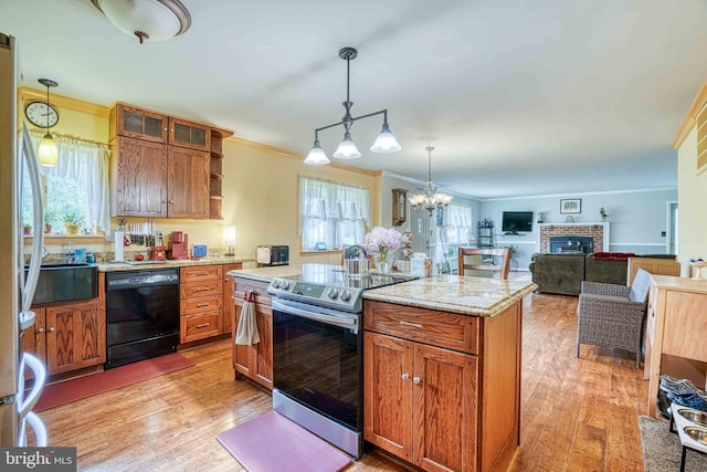 14957 Cherry Ln, Ridgely, MD 21660 - kitchen with black dishwasher, stainless steel electric stove, healthy amount of natural light, crown molding, and light wood-style floors