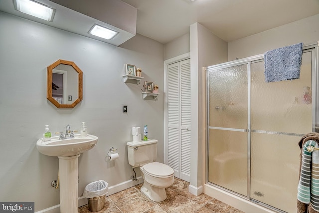 14957 Cherry Ln, Ridgely, MD 21660 - full bath with a closet, toilet, baseboards, a stall shower, and tile patterned flooring