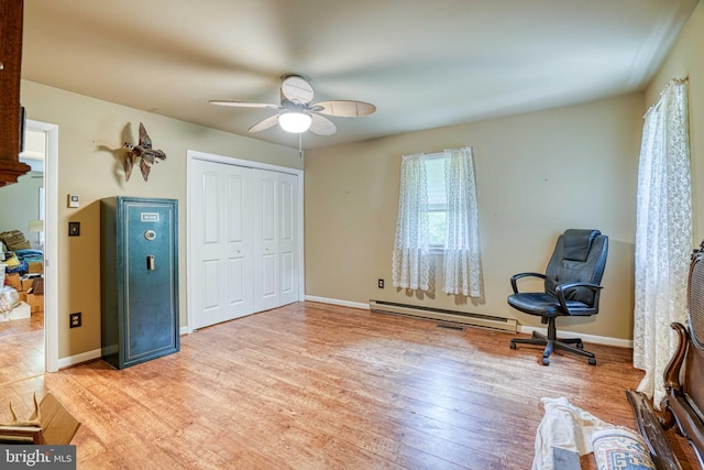 14957 Cherry Ln, Ridgely, MD 21660 - unfurnished room with a baseboard heating unit, ceiling fan, light wood-style flooring, and baseboards