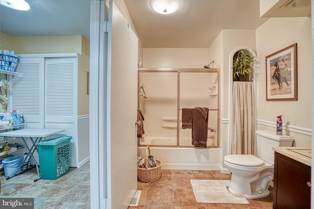 14957 Cherry Ln, Ridgely, MD 21660 - full bathroom with shower / bath combination with glass door, toilet, vanity, and a closet