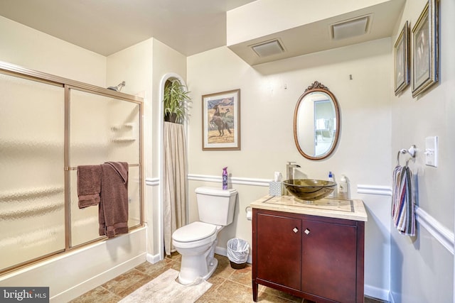 14957 Cherry Ln, Ridgely, MD 21660 - full bathroom featuring vanity, combined bath / shower with glass door, toilet, and baseboards