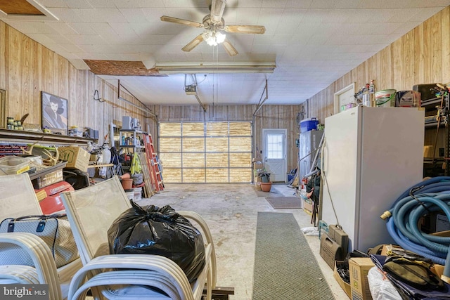 14957 Cherry Ln, Ridgely, MD 21660 - garage featuring wood walls, a garage door opener, and ceiling fan
