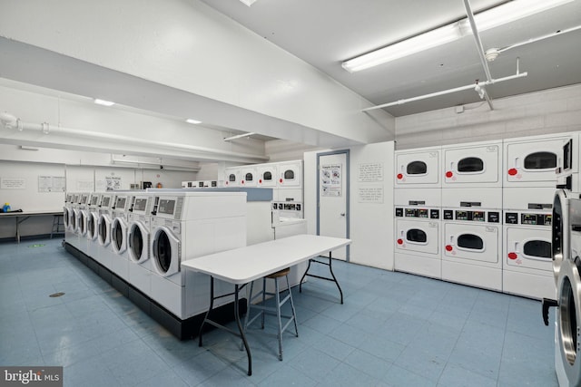 604 S Washington Sq Unit 1408, Philadelphia, PA 19106 - community laundry with estacked washer and dryer, separate washer and dryer, and tile patterned flooring