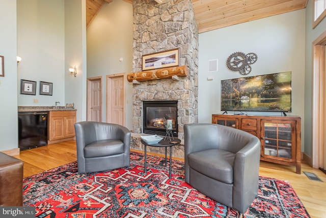 165 Westward Way, Mc Henry, MD 21541 - living room featuring high vaulted ceiling, a stone fireplace, light wood-style flooring, and visible vents
