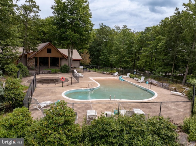 165 Westward Way, Mc Henry, MD 21541 - pool featuring fence, a patio area, and a forest view