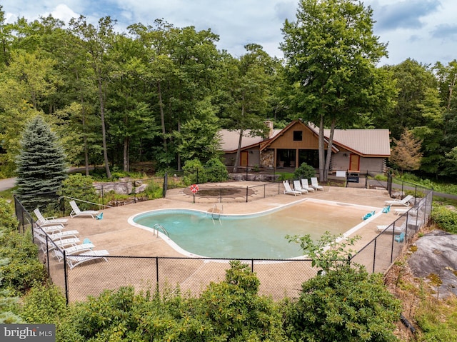 165 Westward Way, Mc Henry, MD 21541 - community pool featuring a patio, fence, and a wooded view