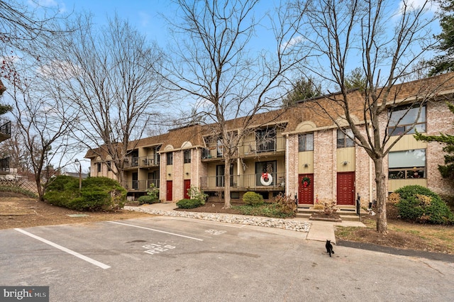 338 Saybrook Ln, Wallingford, PA 19086 - view of front of property with brick siding and uncovered parking