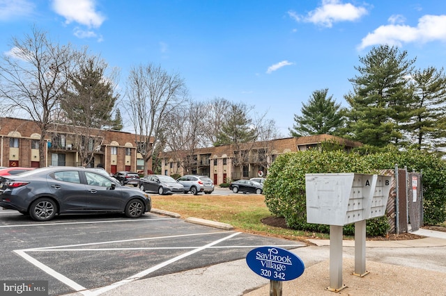 338 Saybrook Ln, Wallingford, PA 19086 - uncovered parking lot featuring mail area and a residential view
