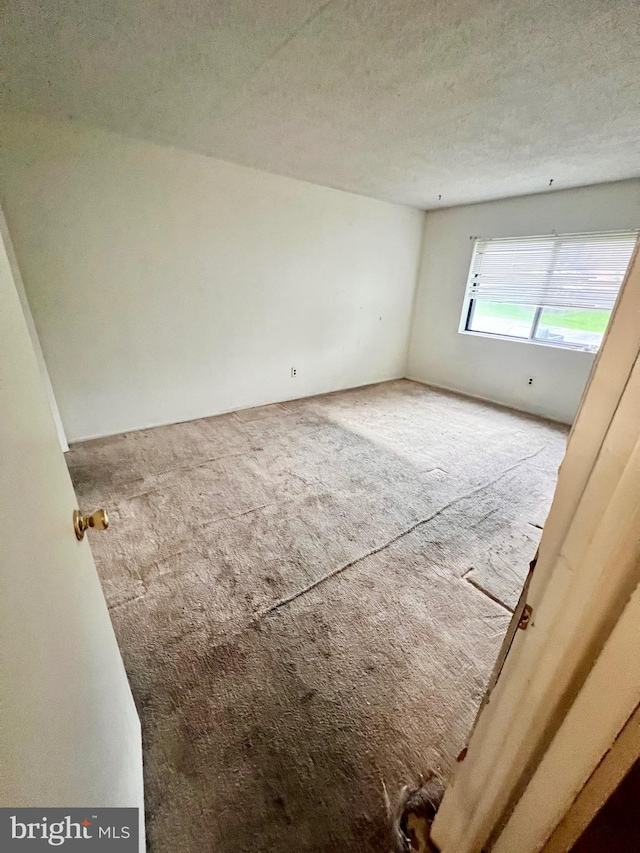 338 Saybrook Ln, Wallingford, PA 19086 - unfurnished room with carpet and a textured ceiling