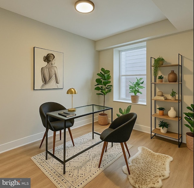 sitting room featuring light wood-style floors and baseboards