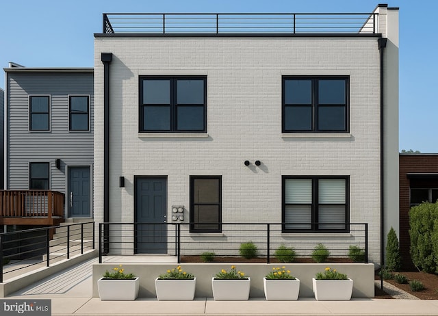 view of front of house with brick siding